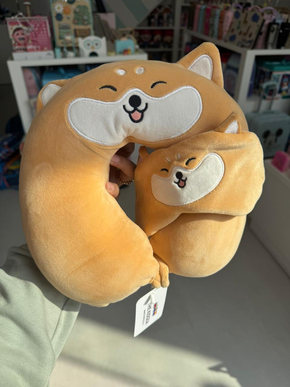 Brown neck pillow with eye mask